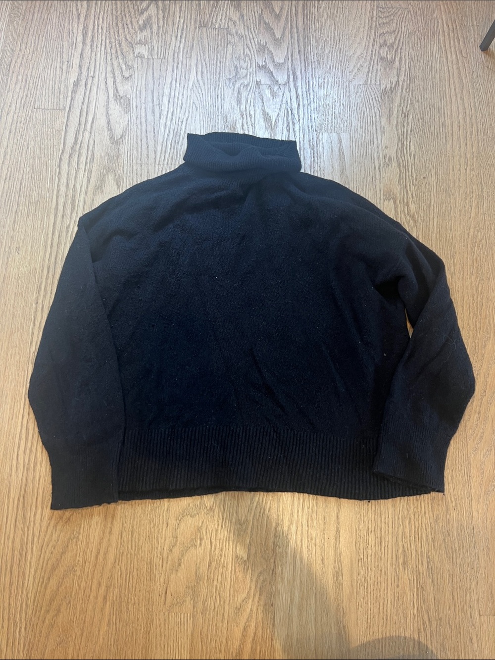 Black boxy turtleneck sweater